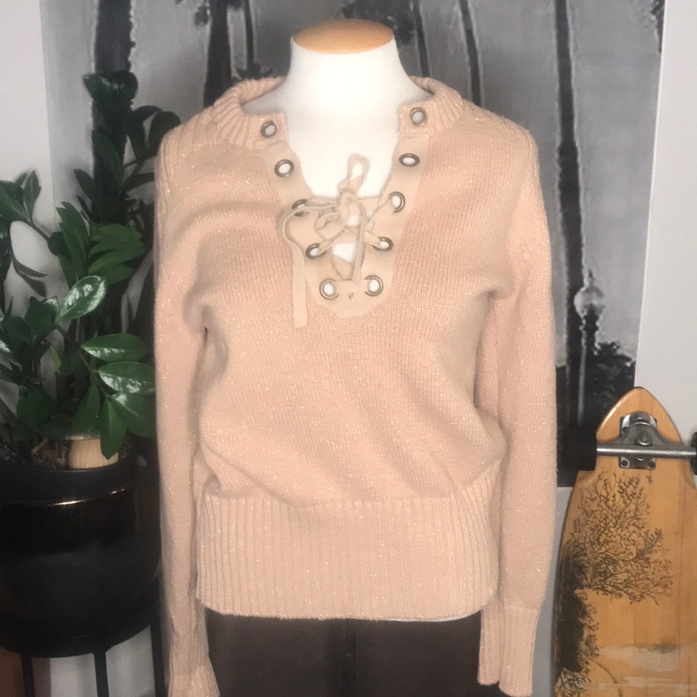 Tan sweater with gold glitter stitching.